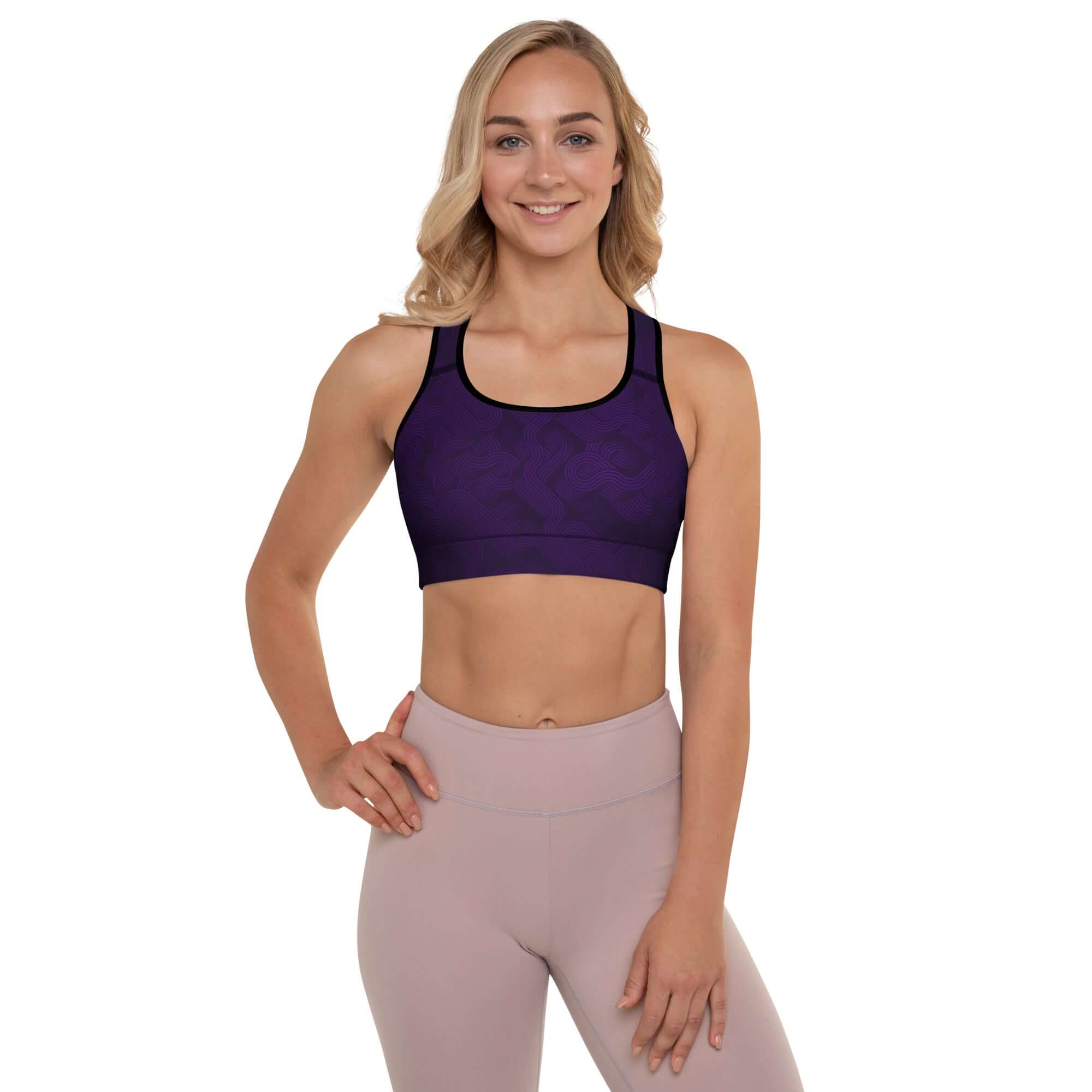 MotionCurve Sports Bra – SculptFit Support in purple worn by a model, showcasing comfort and athletic style.