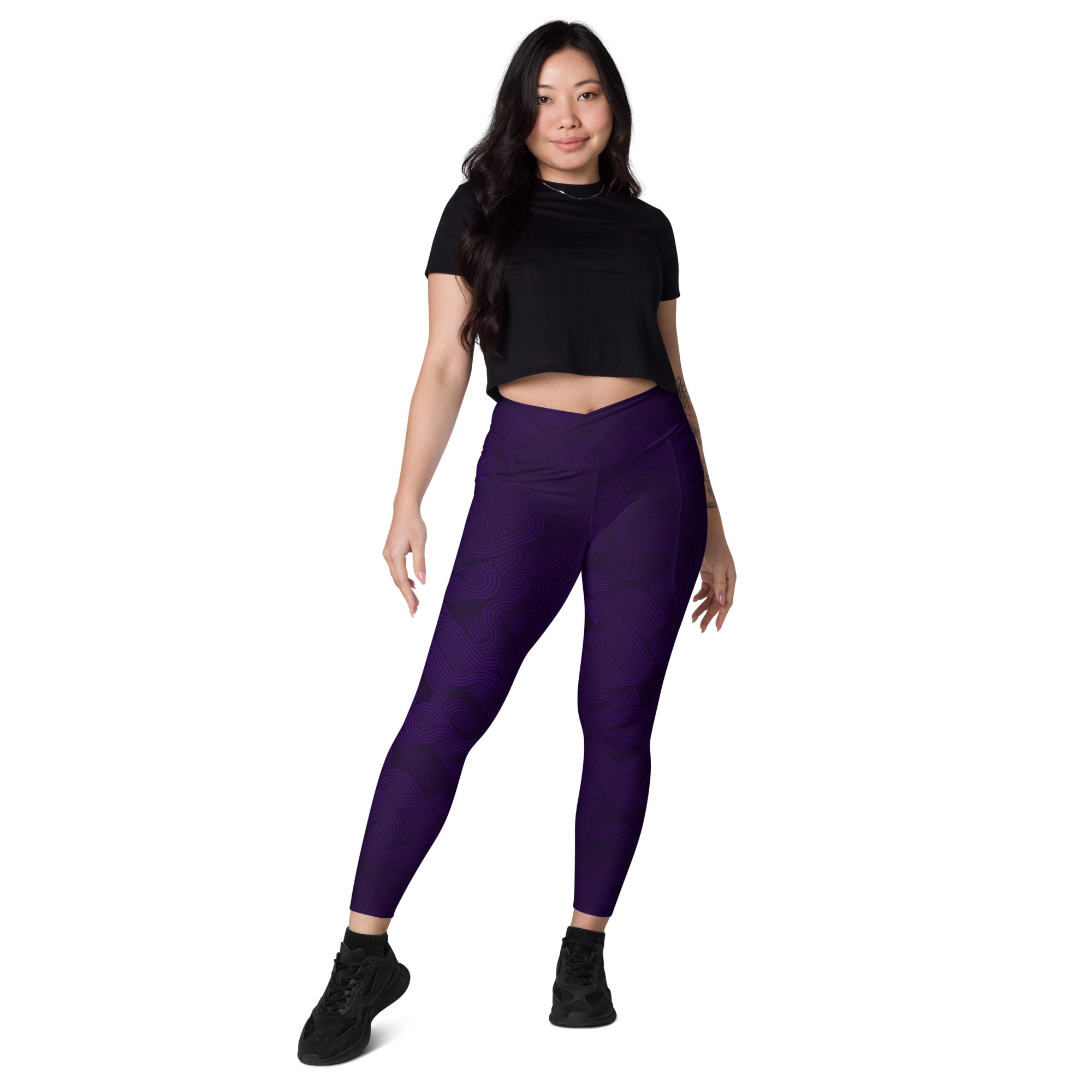 Model showcasing Midnight Sculpt Pocket Leggings – Crossover Edition in bold purple with a stylish black crop top.