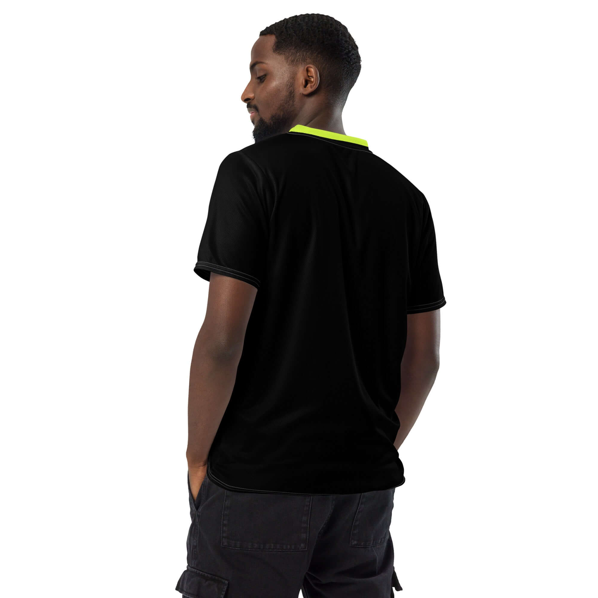 Man wearing the CoreDry V-Neck Training Jersey in black with lime trim, showcasing its breathable design.