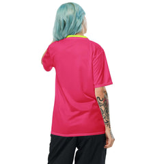 Back view of a woman in a hyper pink PowerPlay V-Neck Jersey with neon detailing, showcasing vibrant style and performance.
