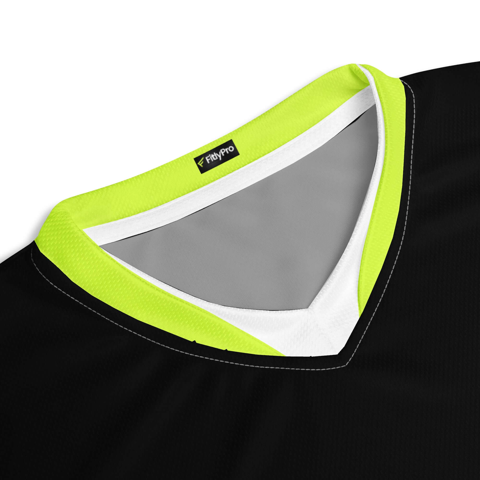Close-up of CoreDry V-Neck Training Jersey featuring black fabric and lime trim design.