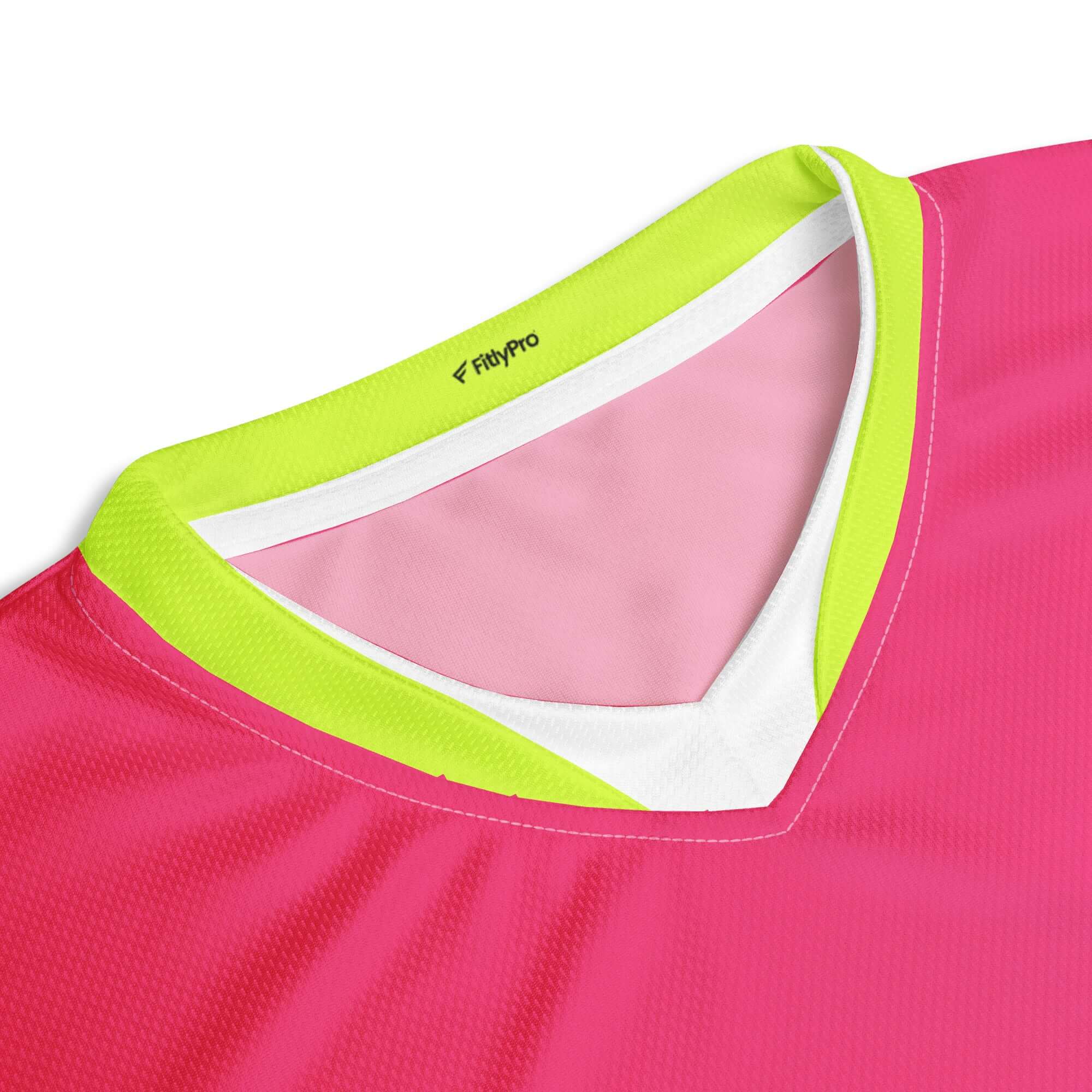 Close-up of the PowerPlay V-Neck Jersey collar in hyper pink with neon green detailing.