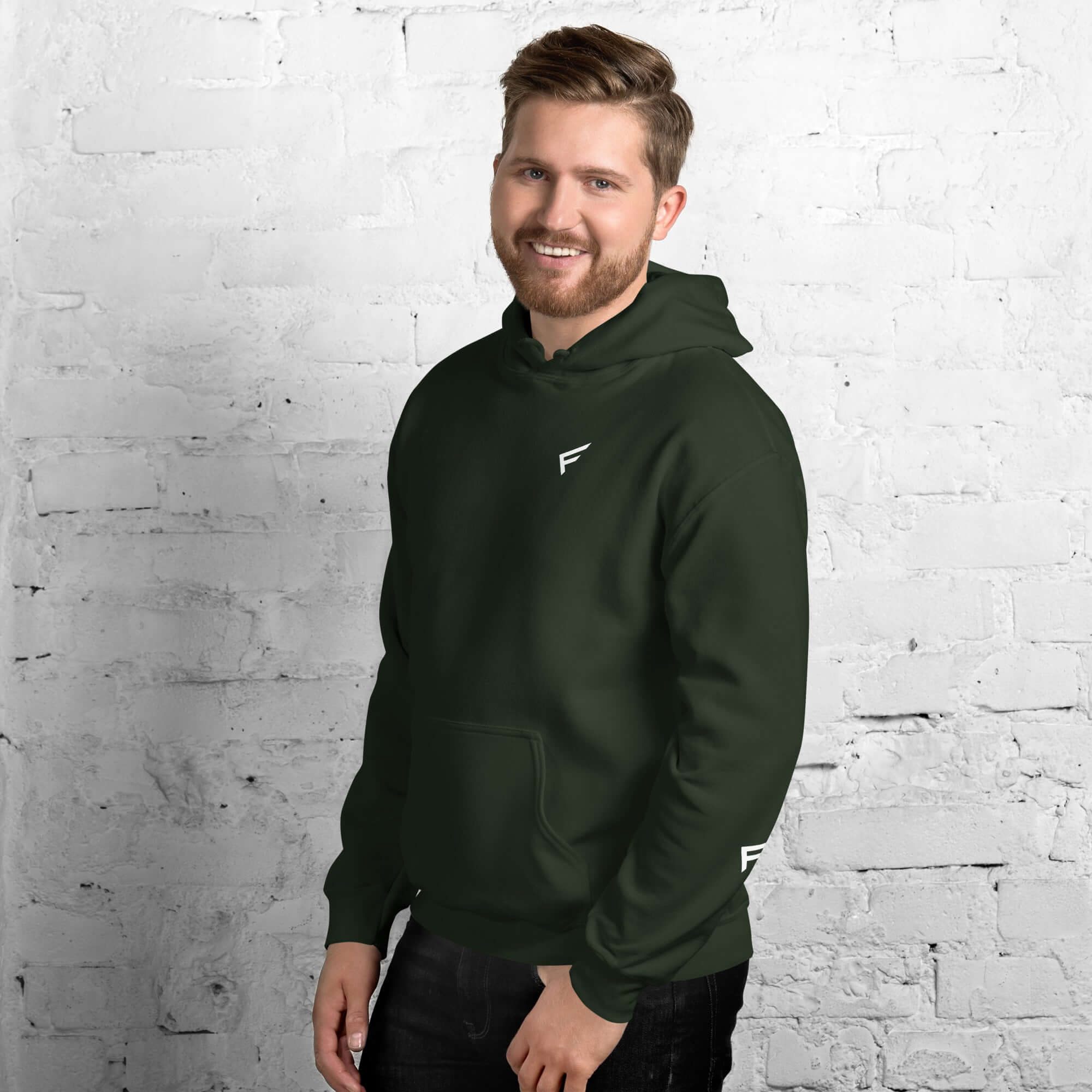 Man wearing a green men's hoodie from the Core Collection, featuring a classic design and soft cotton blend.