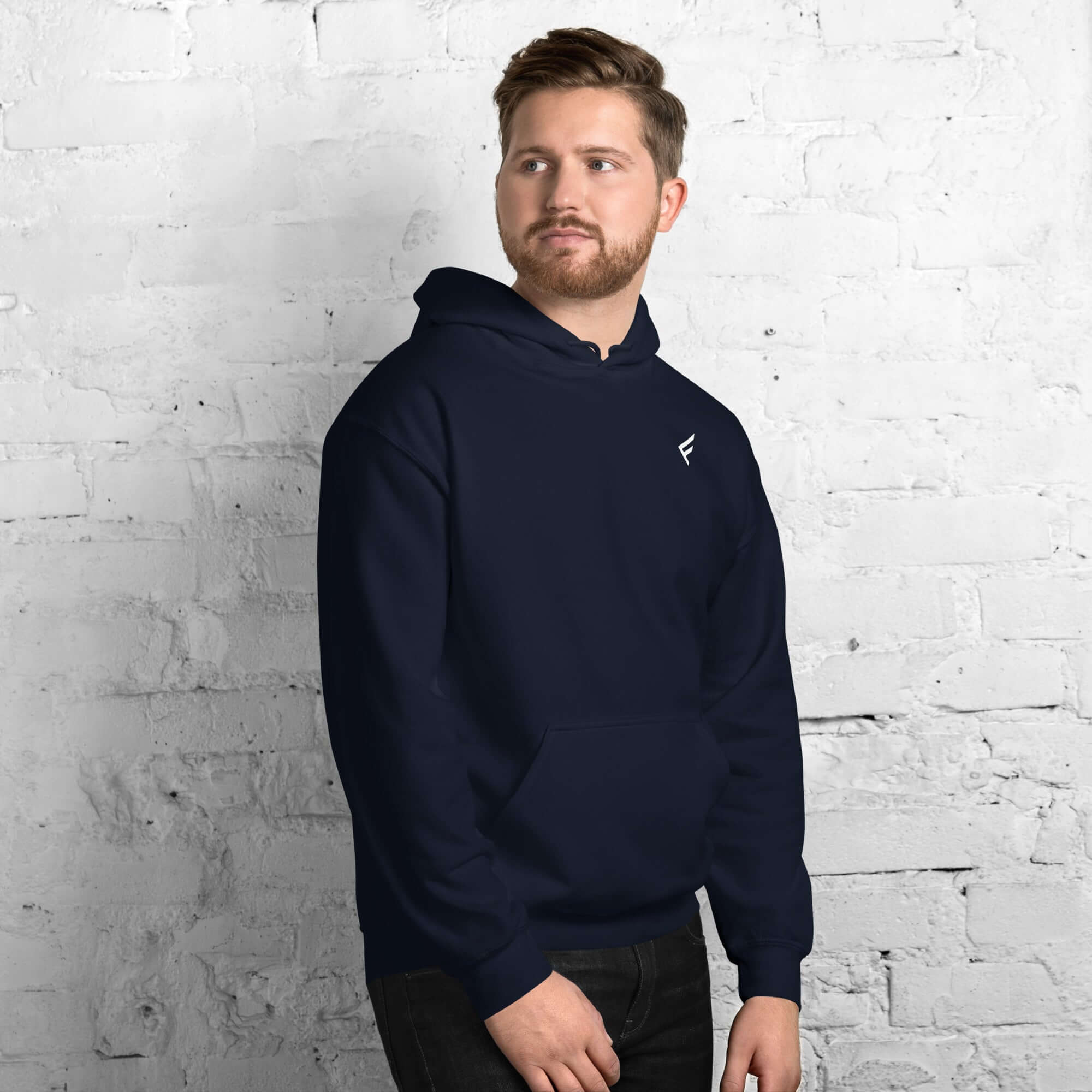 Man wearing a navy blue hoodie from the Core Collection, showcasing classic style and comfort.